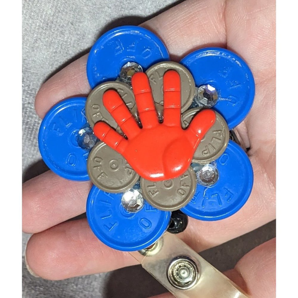 Hand Flower Badge Reel